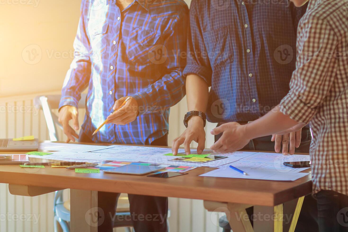 Smooth Focus, group of web designers are working together to develop mobile responsive website with UI UX Front End Designer Previewing. website designers in form of mobile applications with UI UX photo