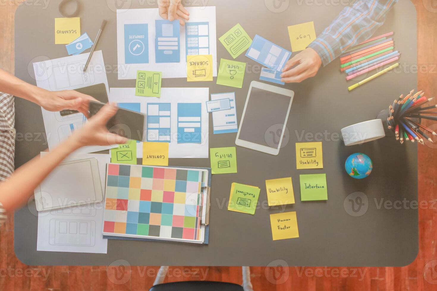 Smooth Focus, group of web designers are working together to develop mobile responsive website with UI UX Front End Designer Previewing. website designers in form of mobile applications with UI UX photo