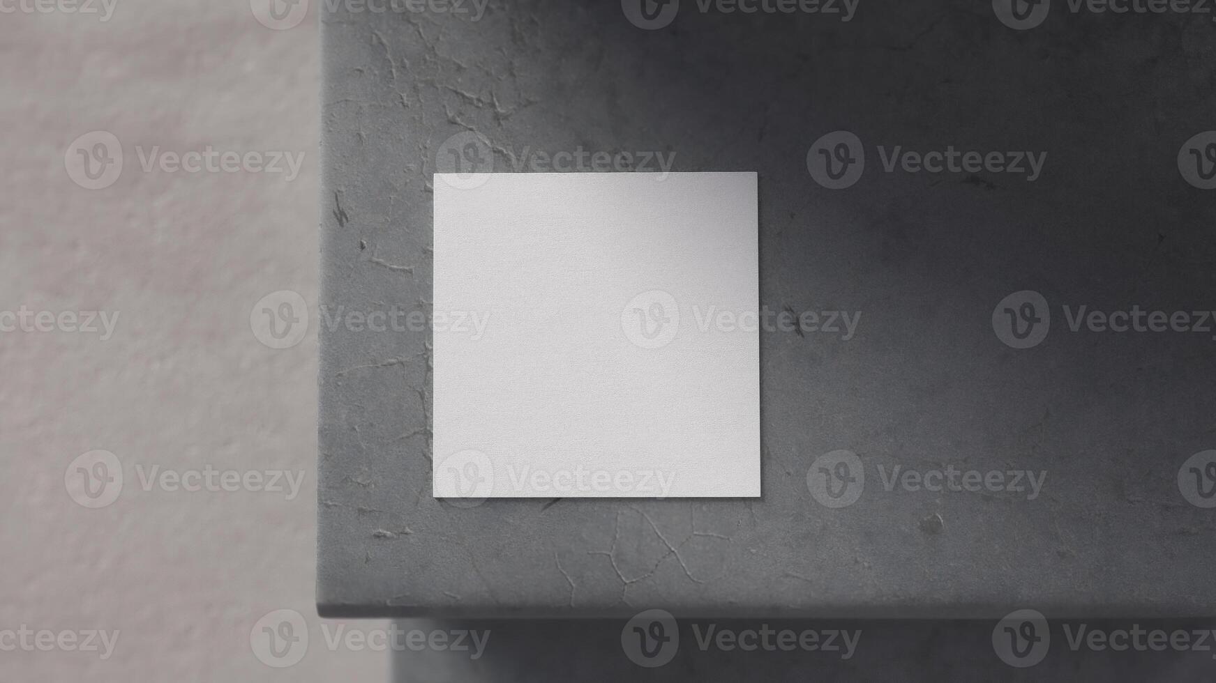 square white card on cracked concrete step seen from above with blurred background photo