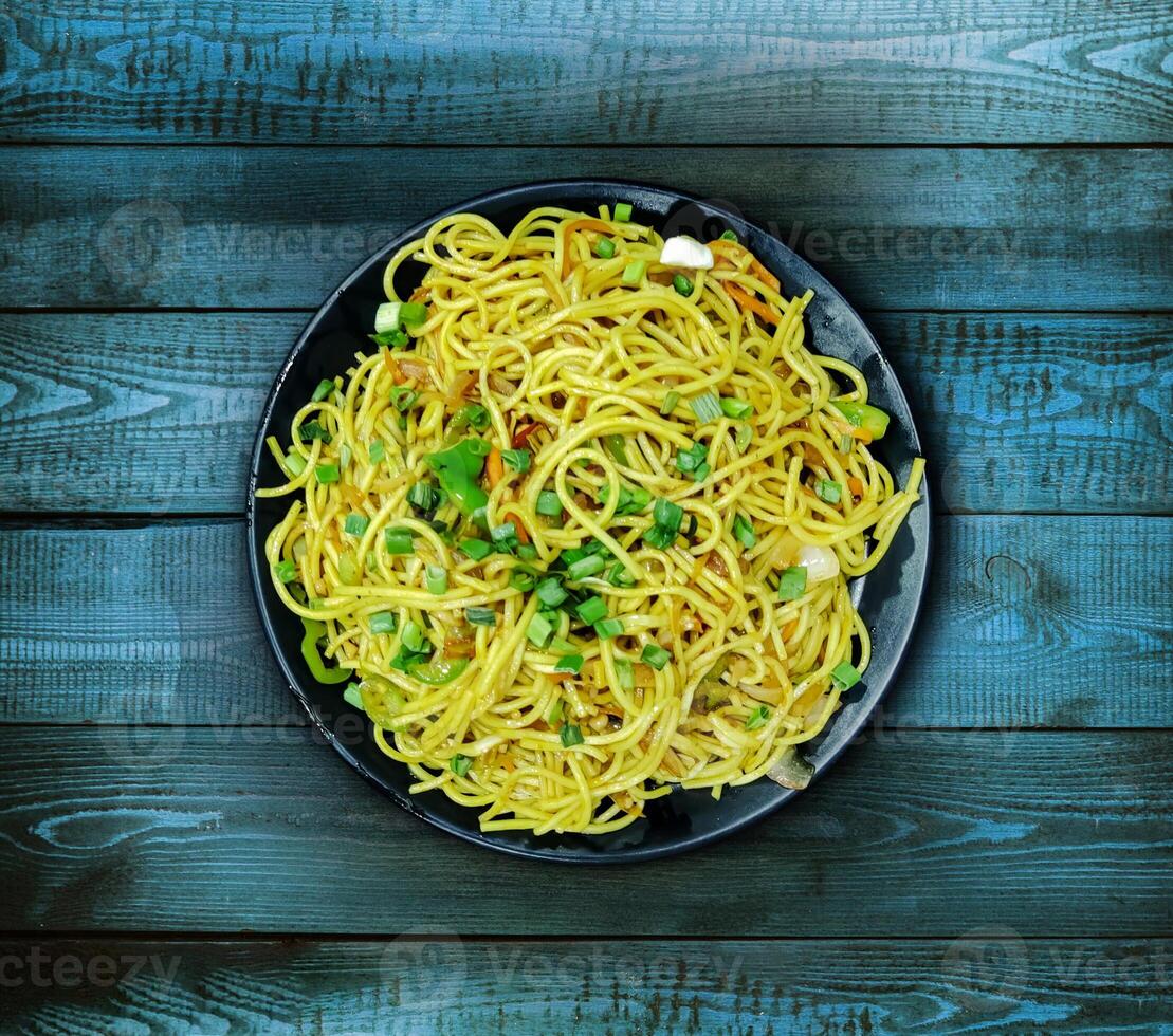 Schezwan Noodles or vegetable Hakka Noodles or chow mein photo