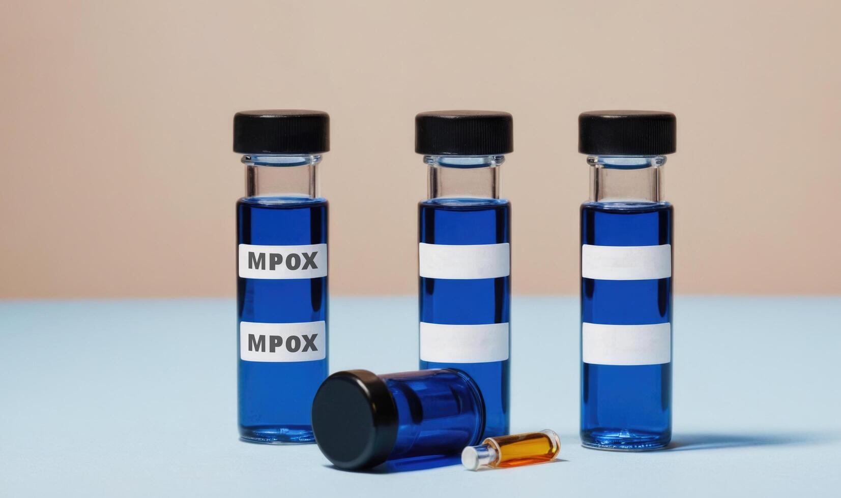 Mpox or Monkey pox vials and syringes on a blue and yellow background photo