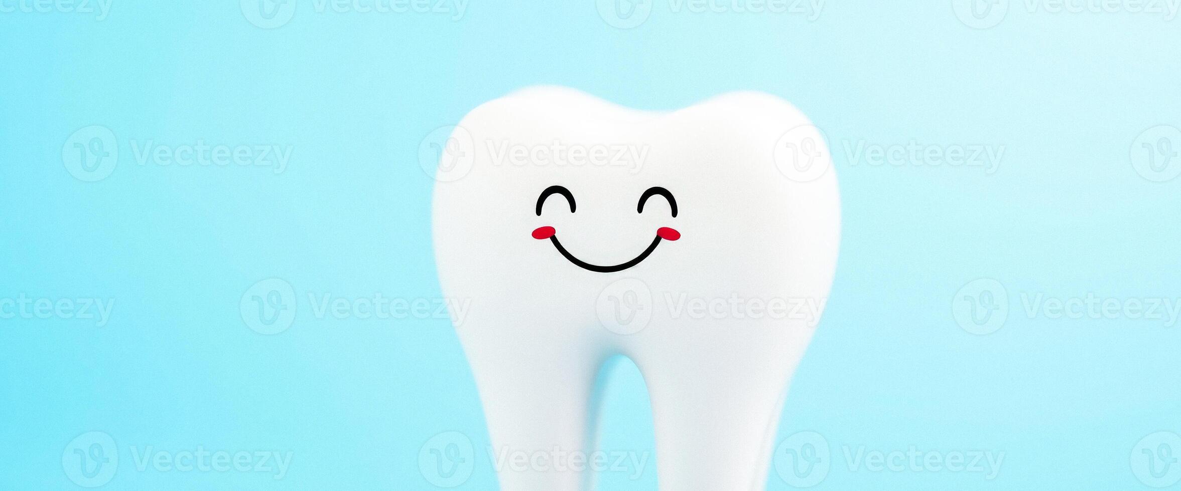 Happy Tooth on Blue Background photo