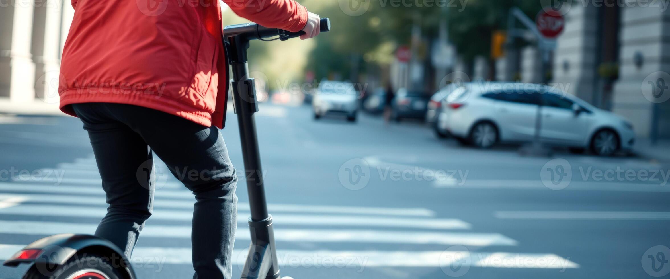 Man riding electric scooter on city street photo