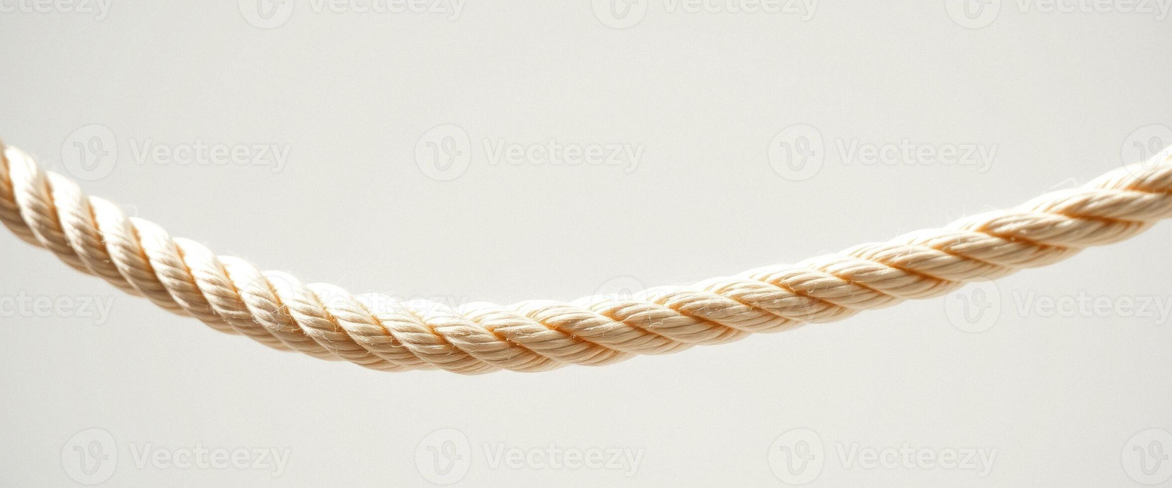 Close up of a beige rope on a white background photo