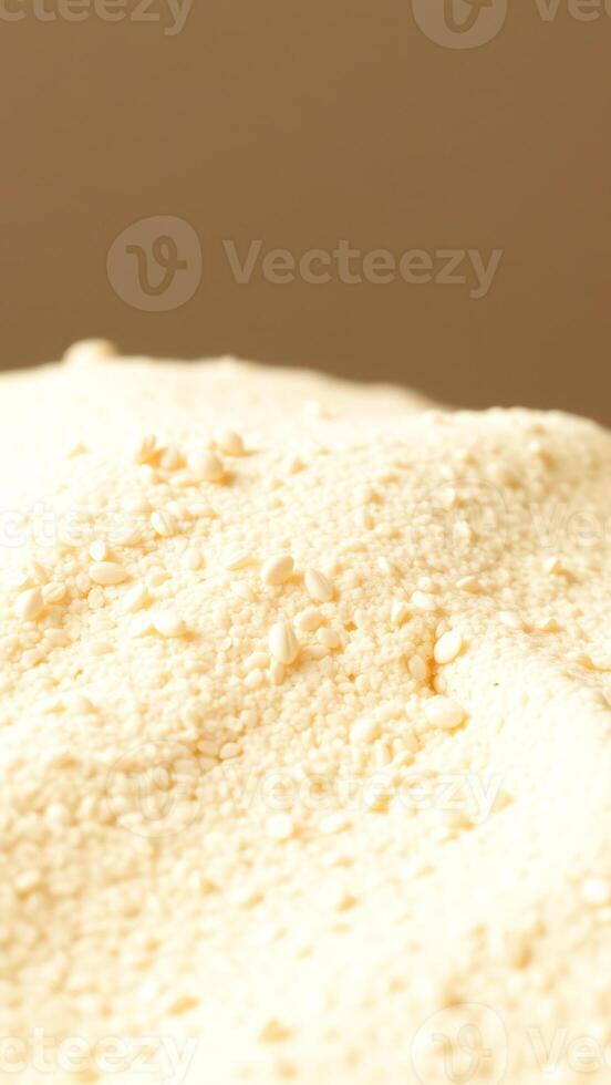 Close-up of White Sesame Seeds on a Soft, Creamy Surface photo