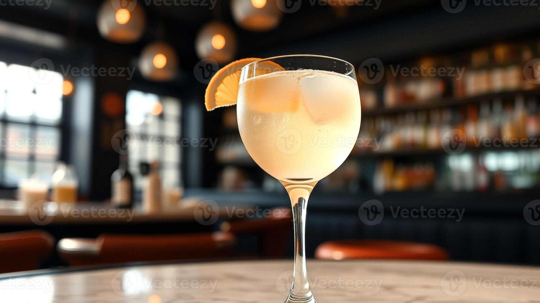 Close Up of a Glass of Orange Juice with Ice Cubes photo