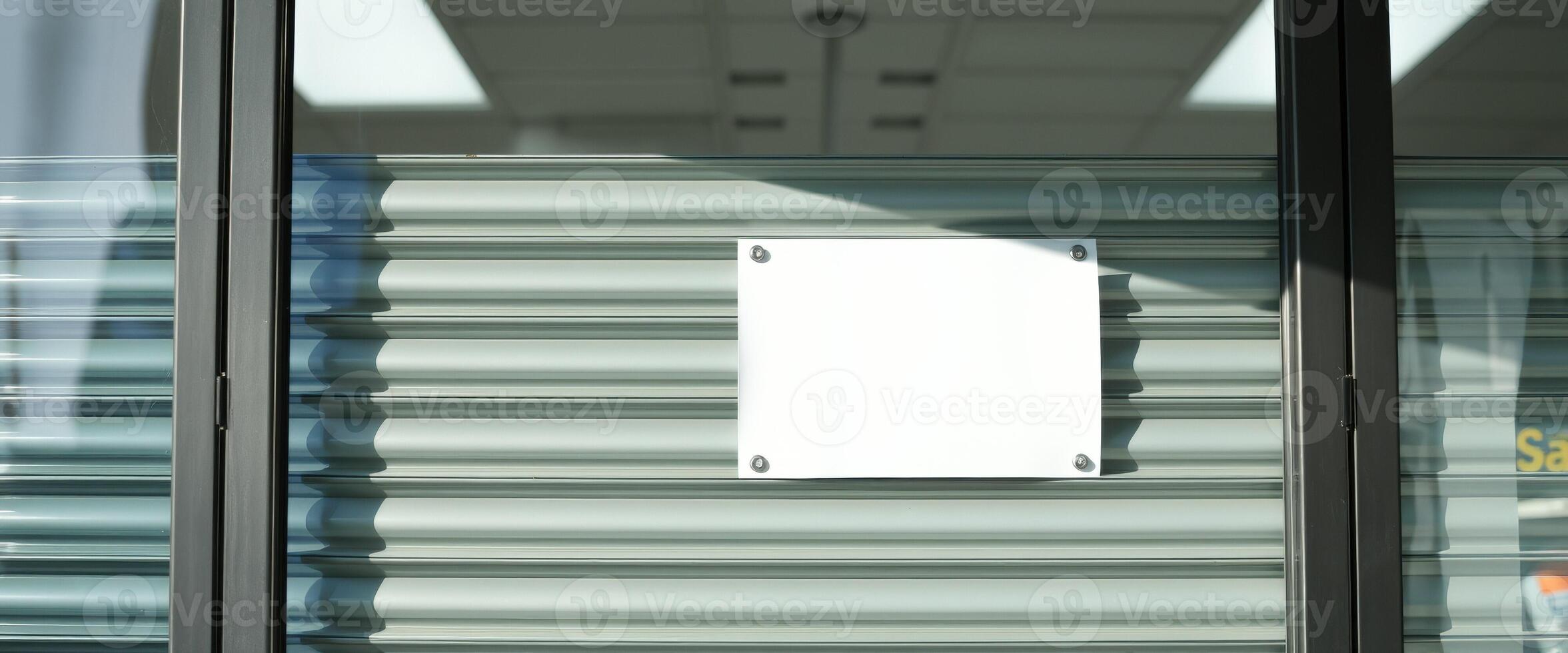 Blank Sign on Closed Store Front photo