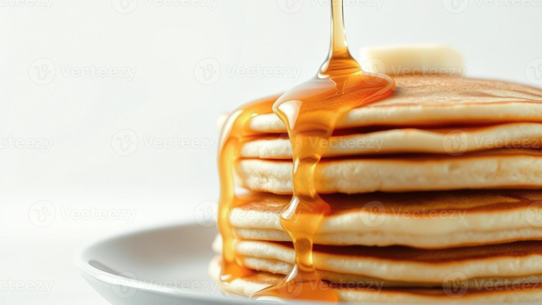 Golden Syrup Drizzling over Fluffy Pancakes photo
