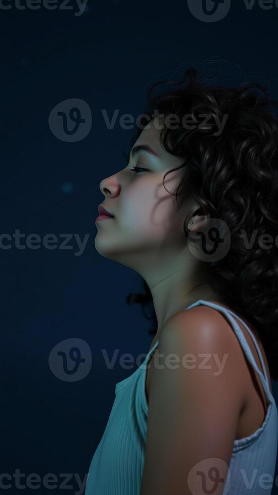 Woman in Profile with a Softly Lit Face photo