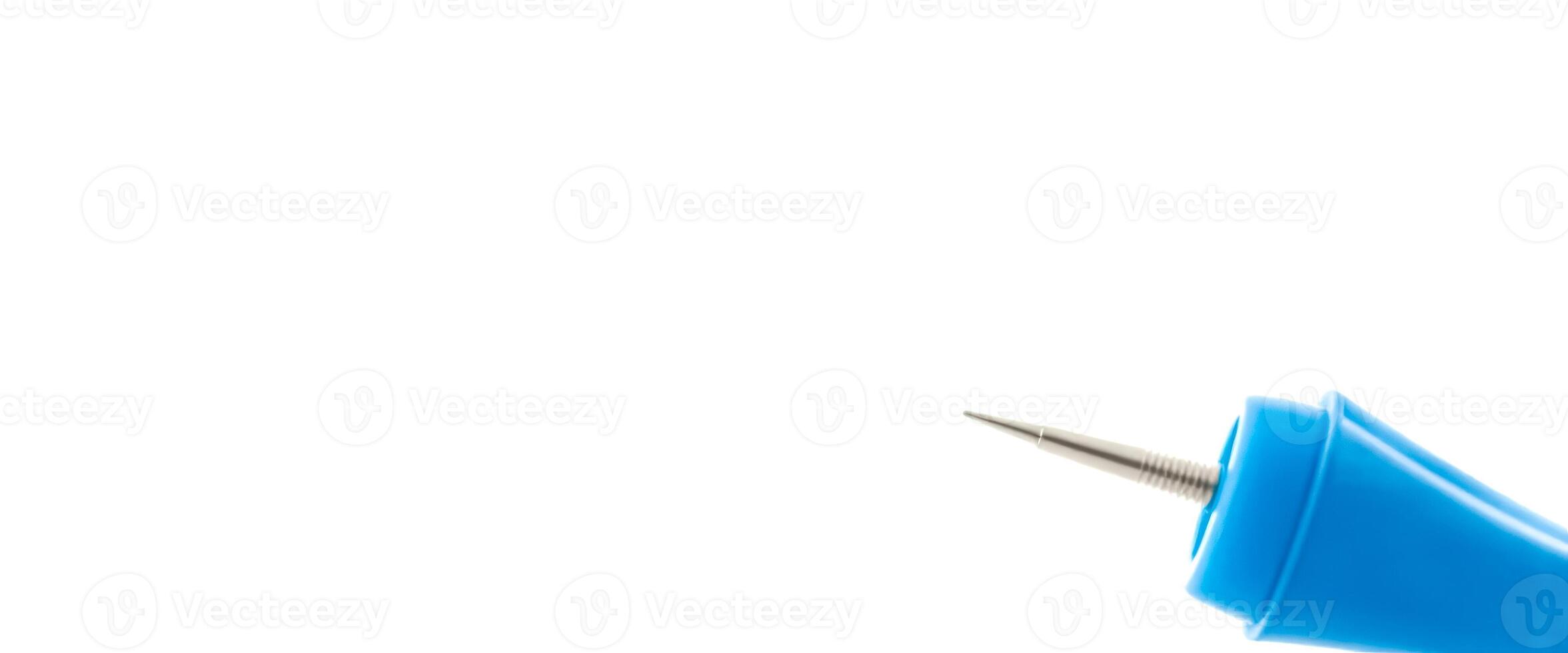 Closeup of a blue pen with a silver tip on a white background photo