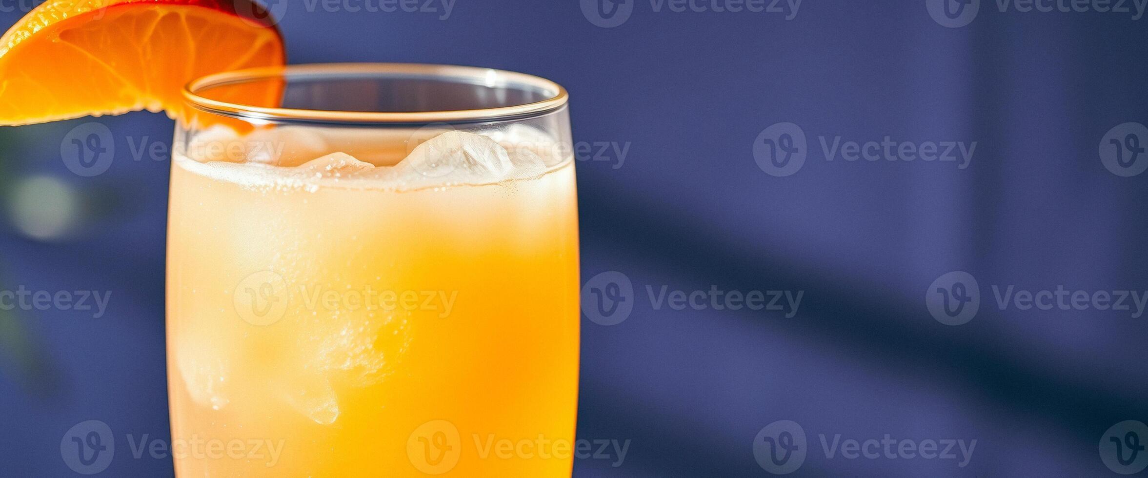Close-up of a refreshing orange drink with ice photo