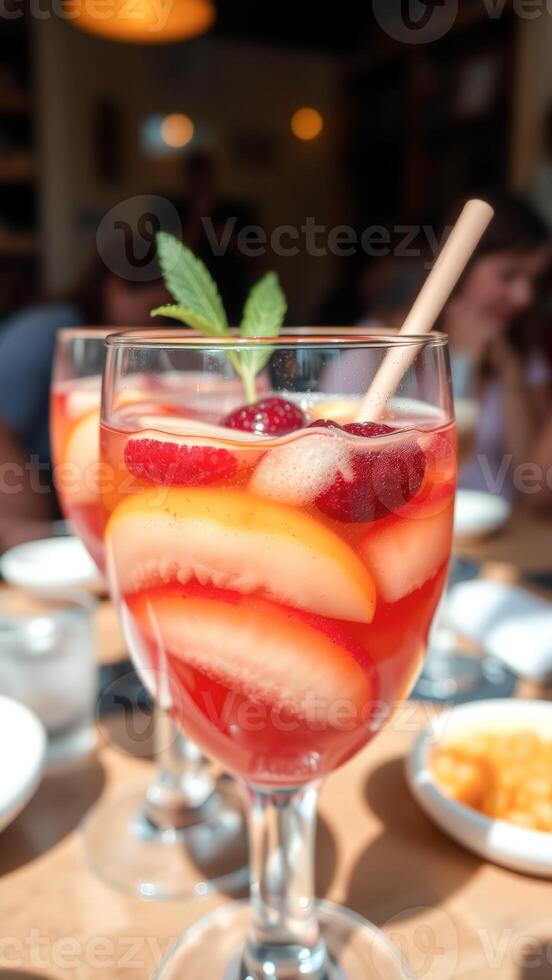 Refreshing Summer Drink with Peach and Berries photo