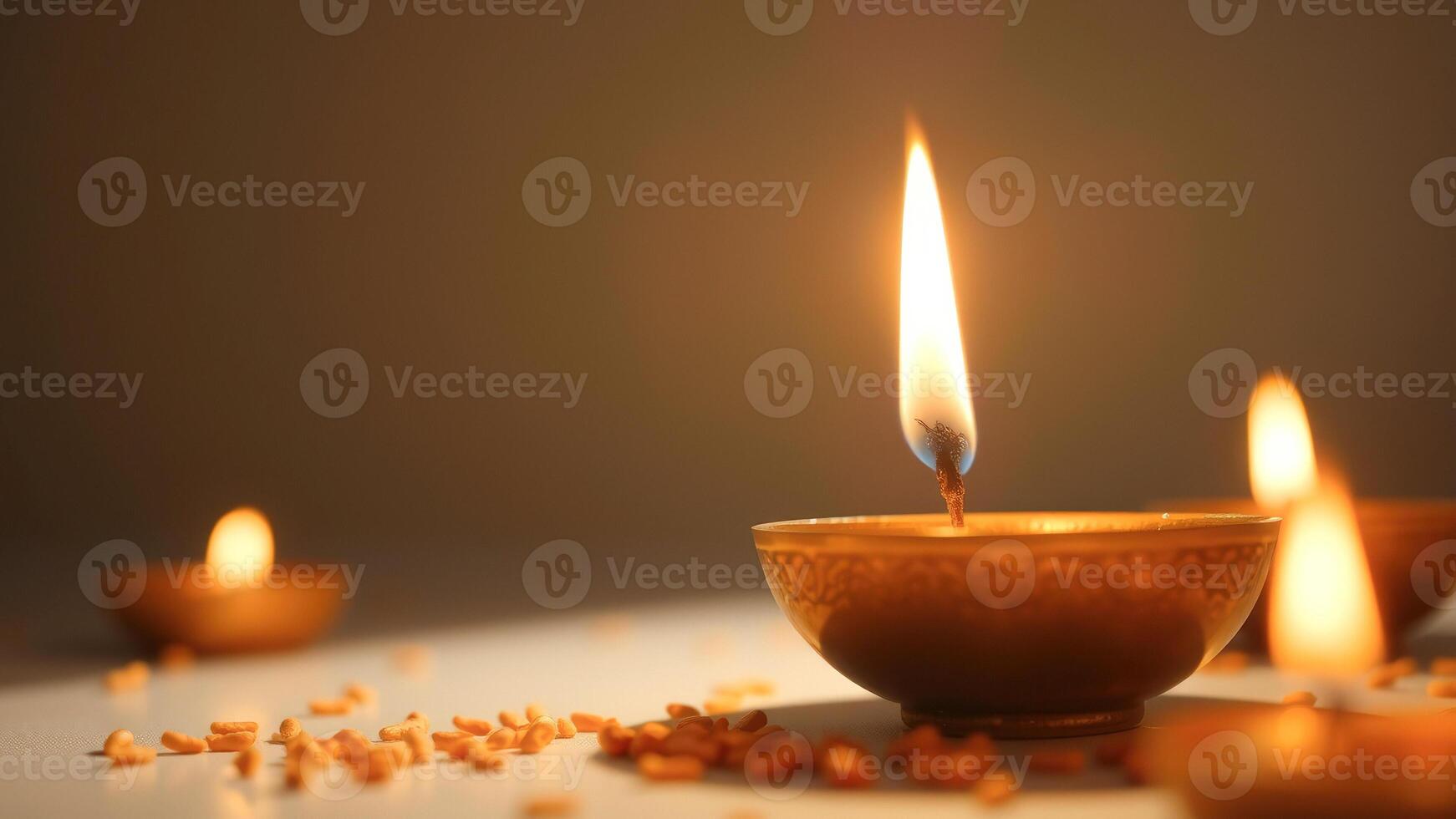 Lit Diya with Scattered Rice Grains photo