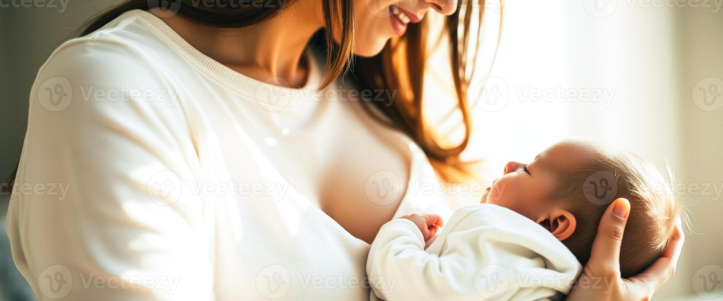 Mother holding her newborn baby photo