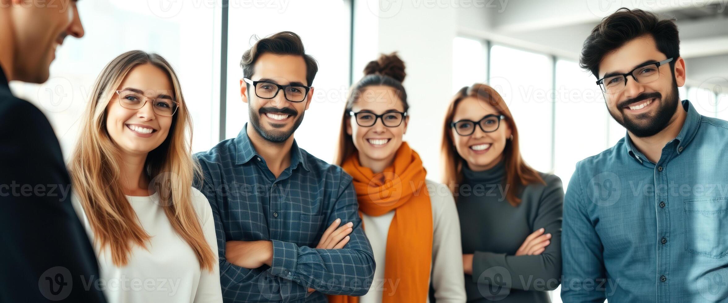 Team of young professionals working together in a modern office photo
