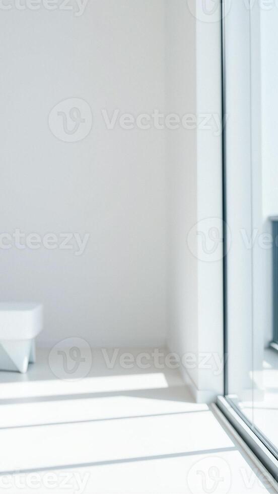 Minimalist White Room with Sunlight Streaming Through Window photo