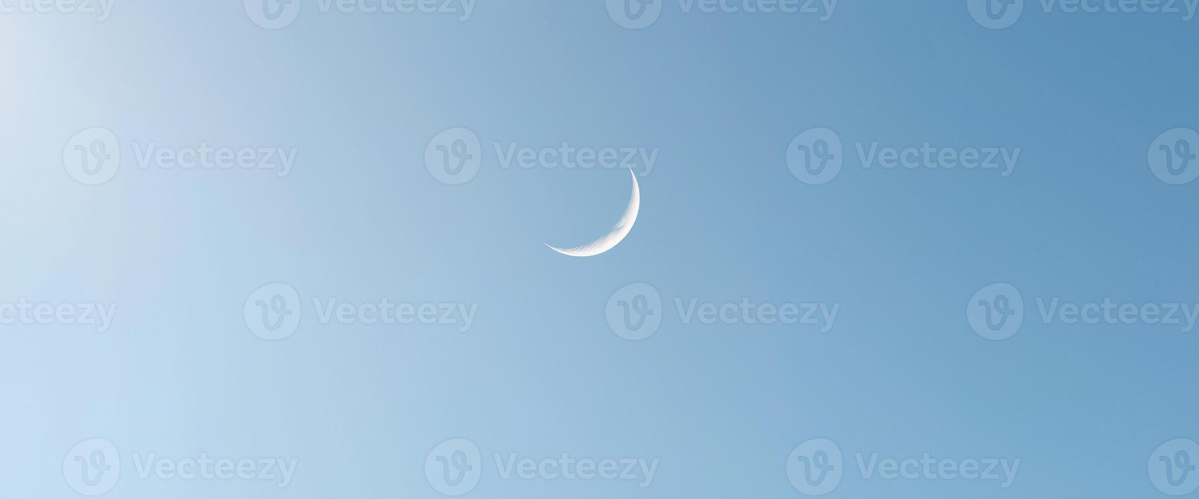 Crescent Moon in a Blue Sky photo