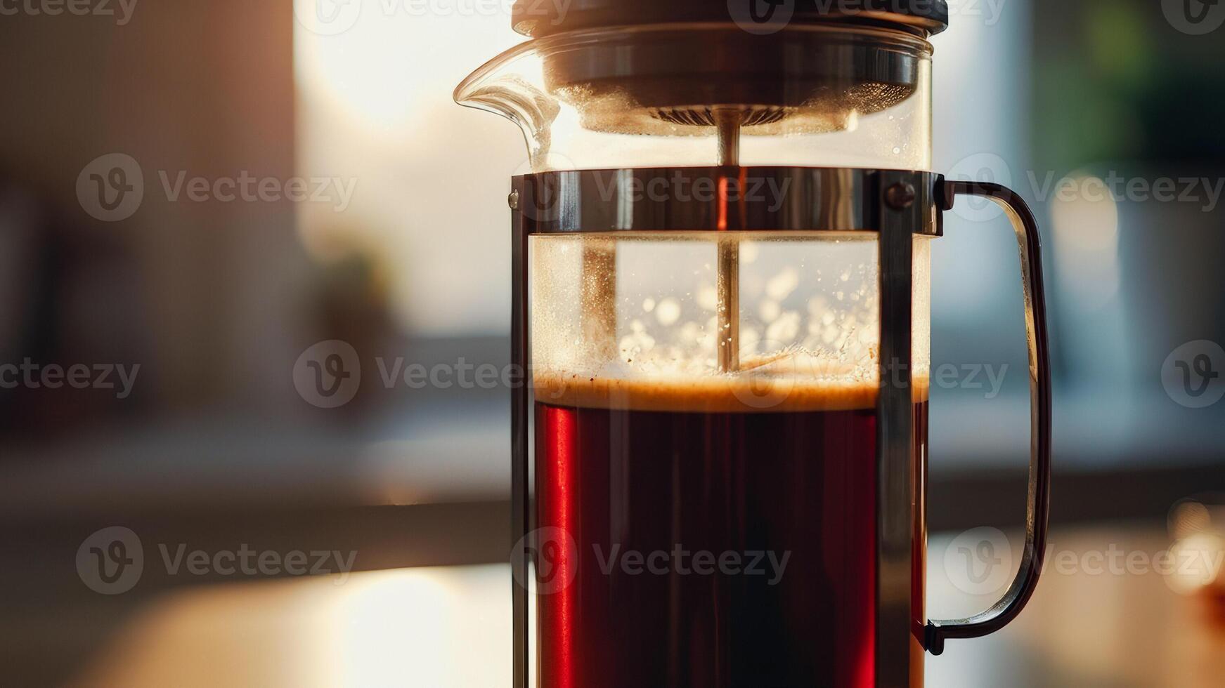 Close-up of a French Press with Coffee Brewing photo