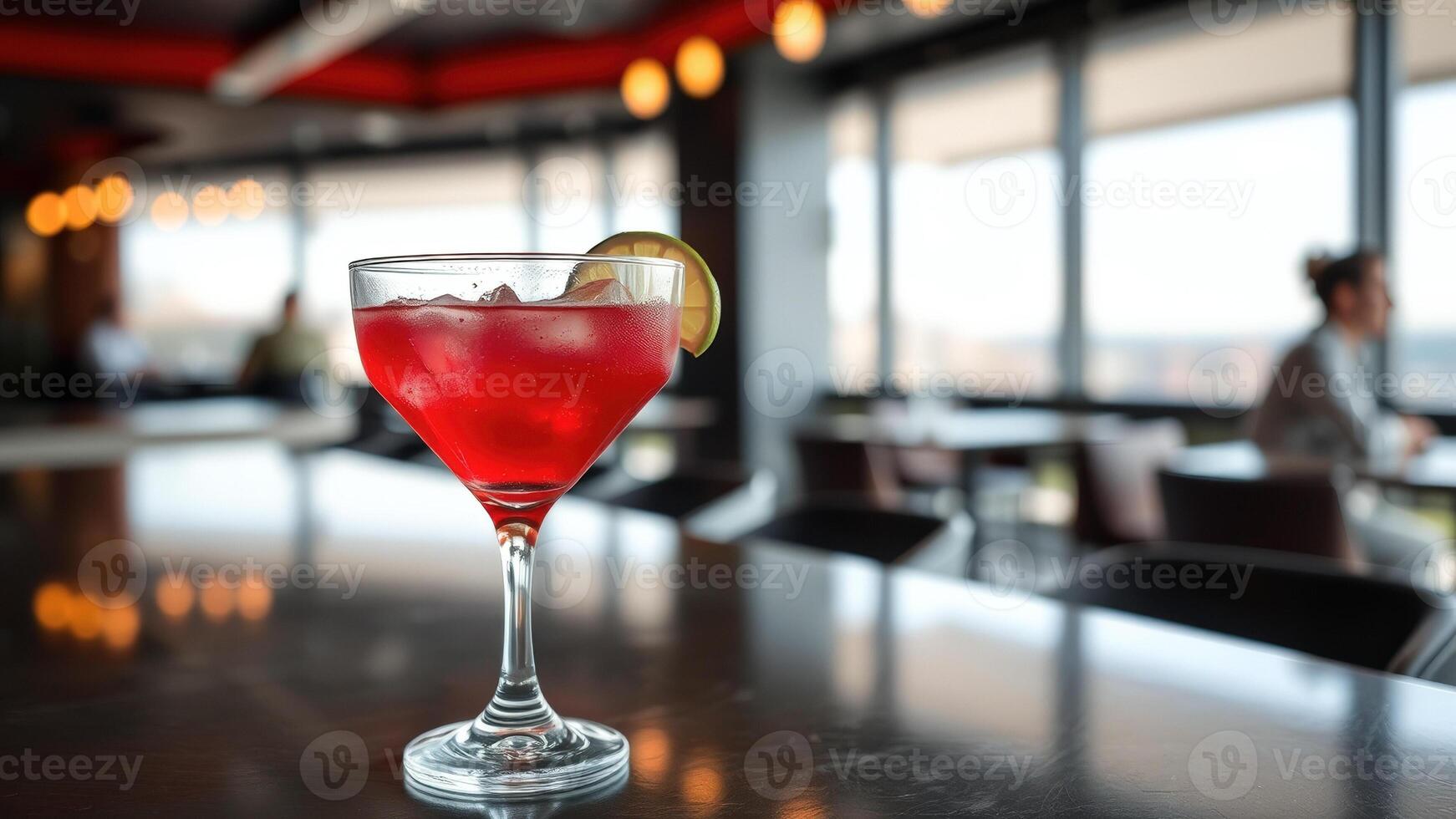 Red Cocktail with Lime Garnish on a Bar Table photo