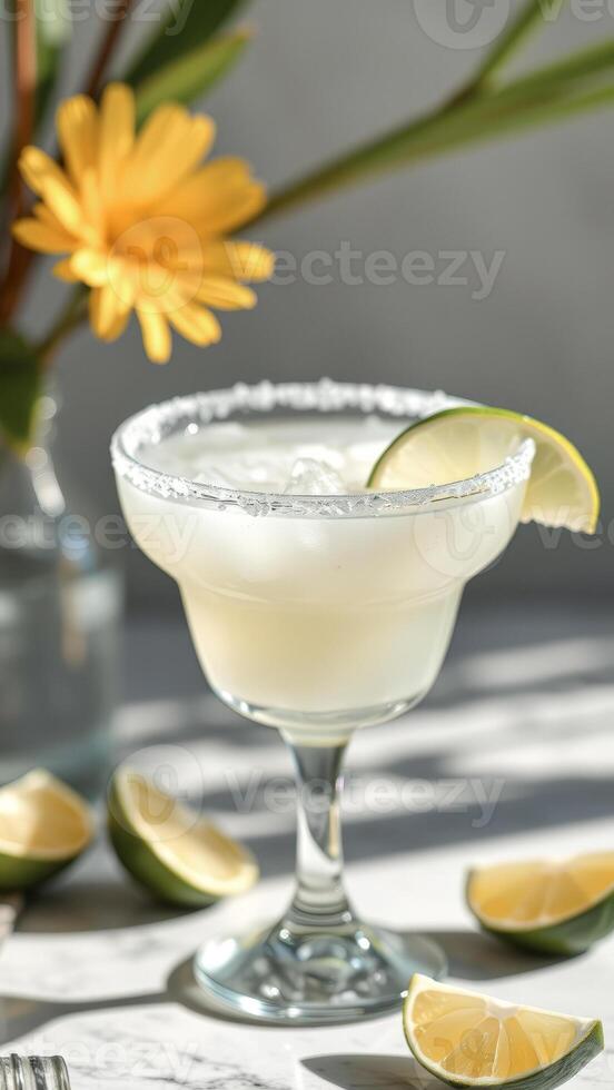 Refreshing Margarita with a Lime Wedge and Salt Rim photo