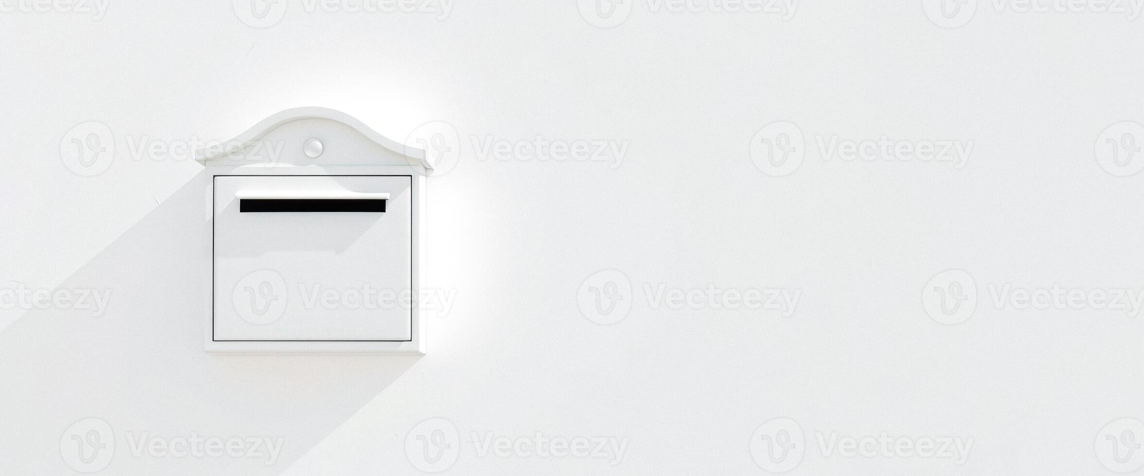 White Mailbox on a White Wall photo