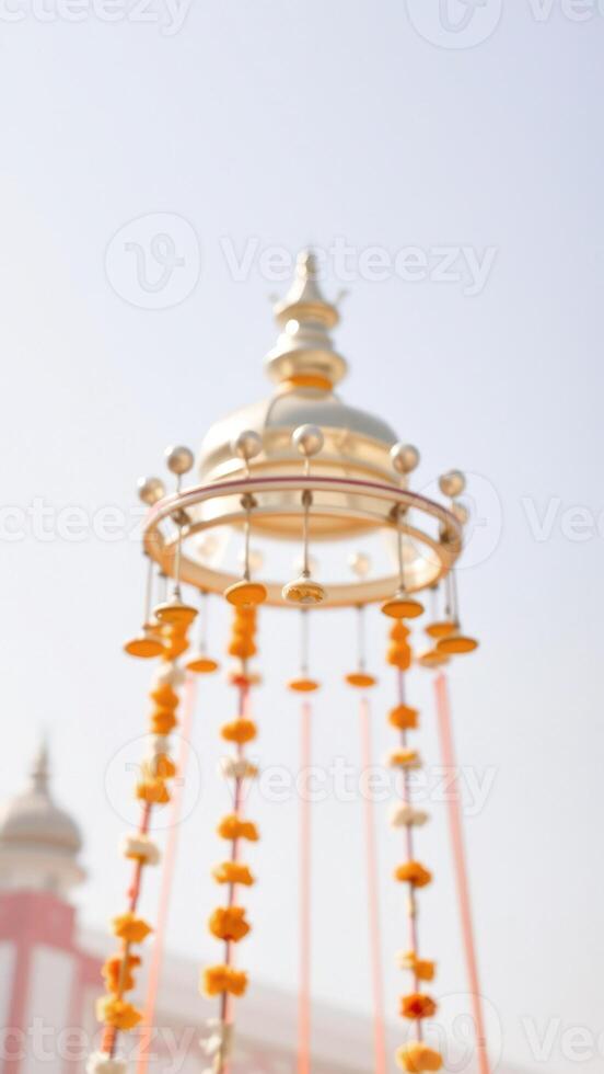 Golden Bells Hanging From A Ceiling photo