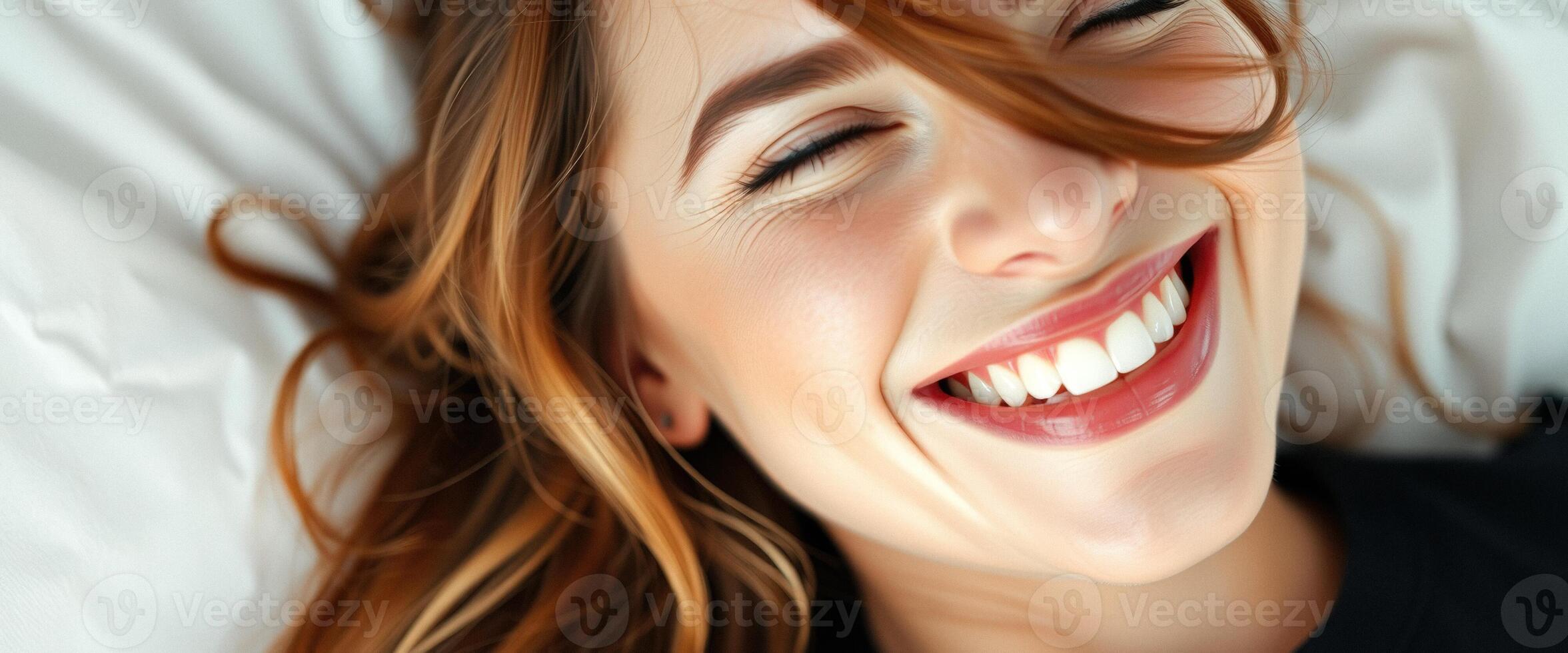 Happy Woman Smiling in Bed photo