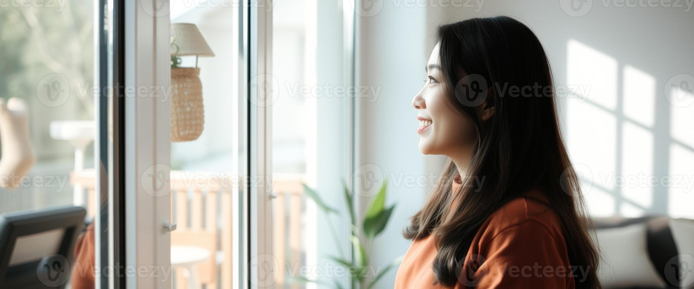 Happy Woman Looking Out Window photo
