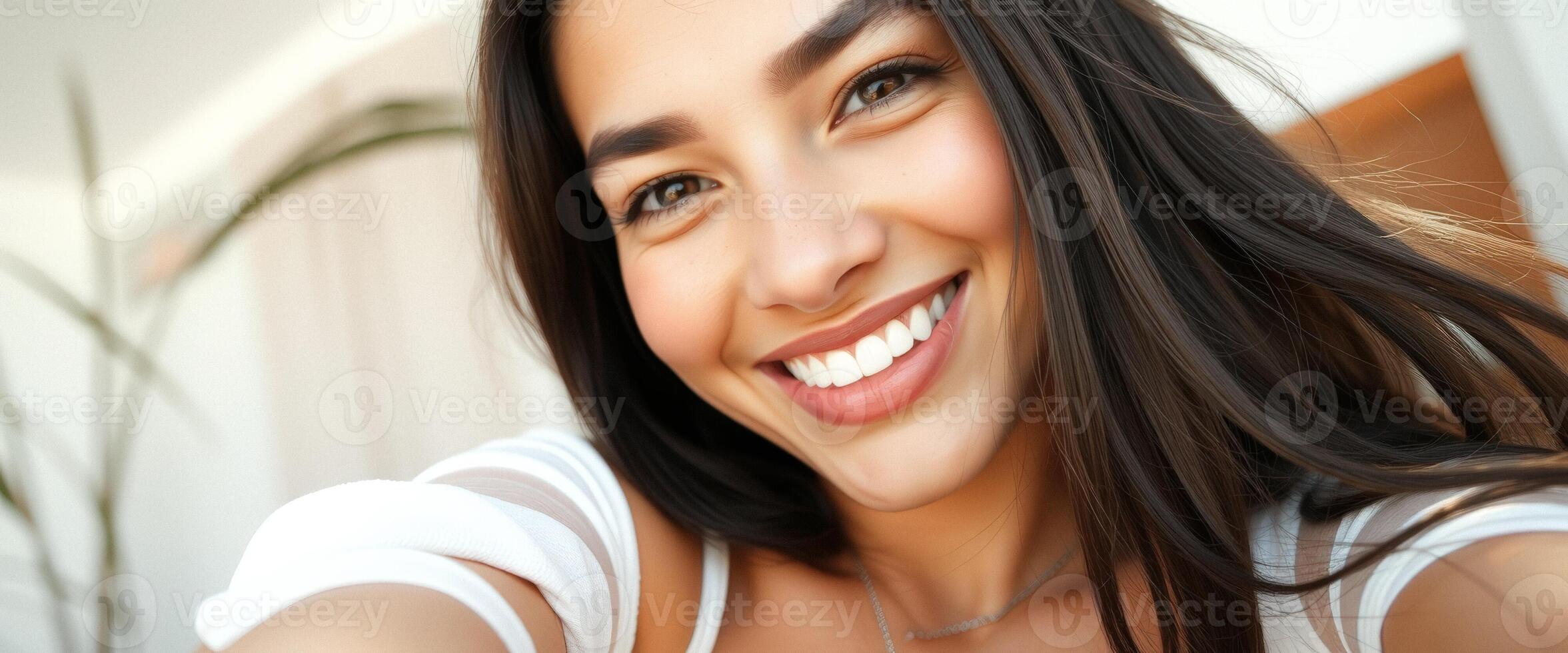 Closeup Portrait of a Smiling Woman with Long Hair photo