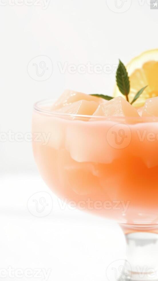 Closeup of Refreshing Peach Cocktail with Ice and Mint Garnish photo