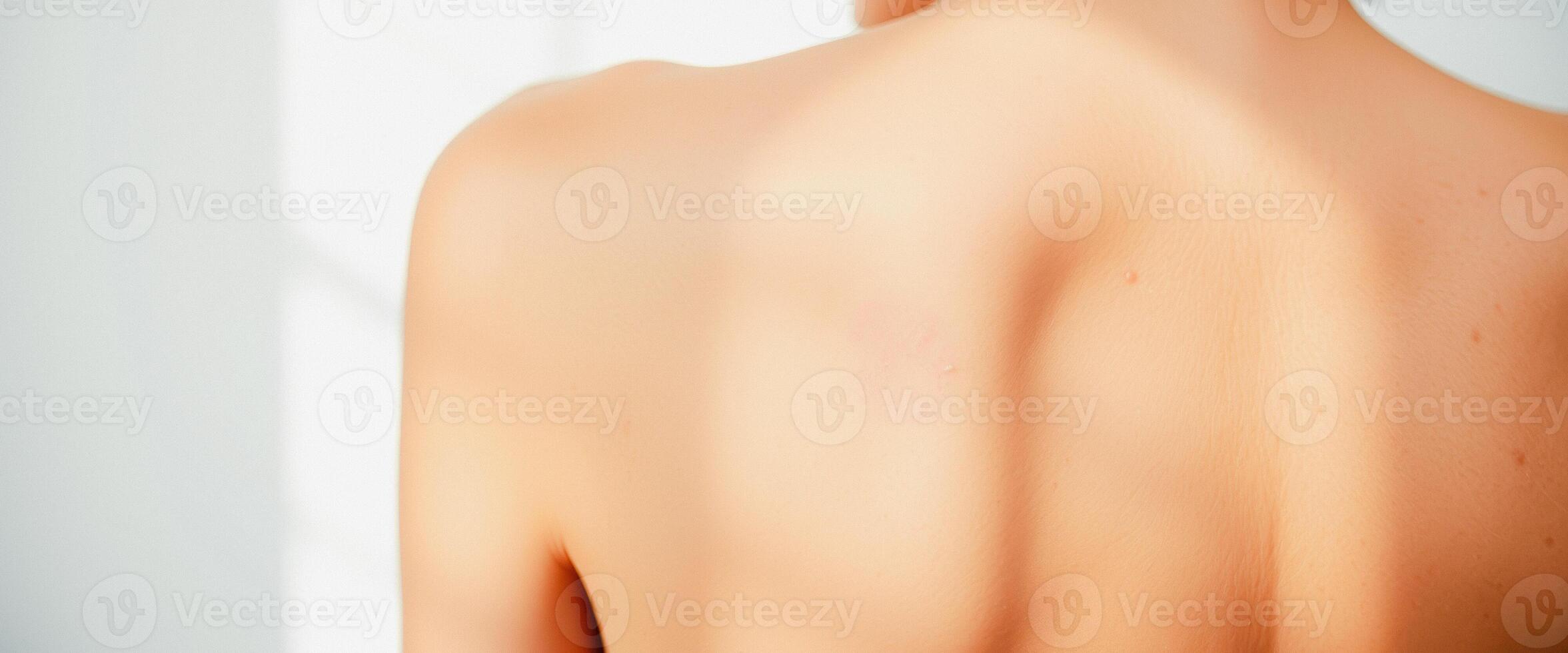 Back of a woman in the sun photo