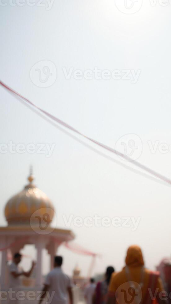 Blurred background with a dome and people in the distance photo