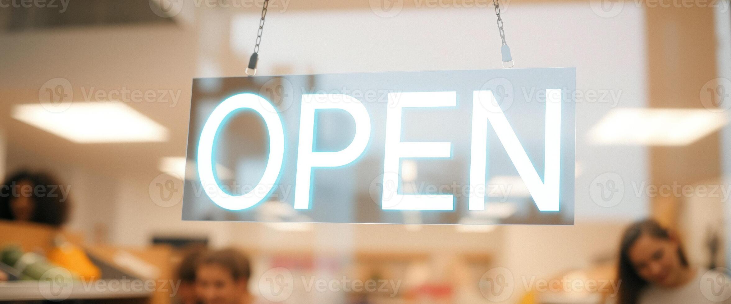 Open Sign Hanging in Store Window photo