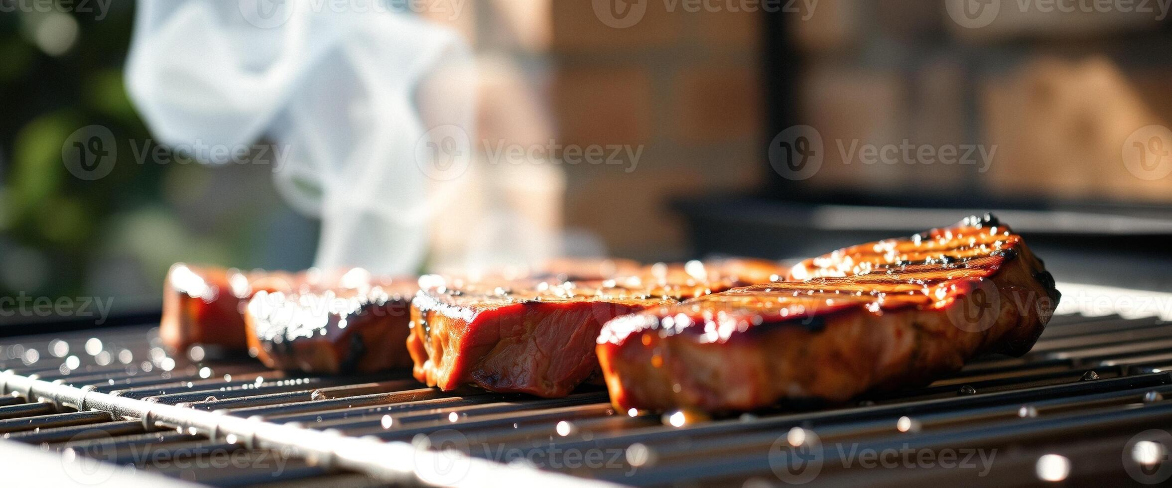 Close up of juicy grilled meat on a barbecue photo