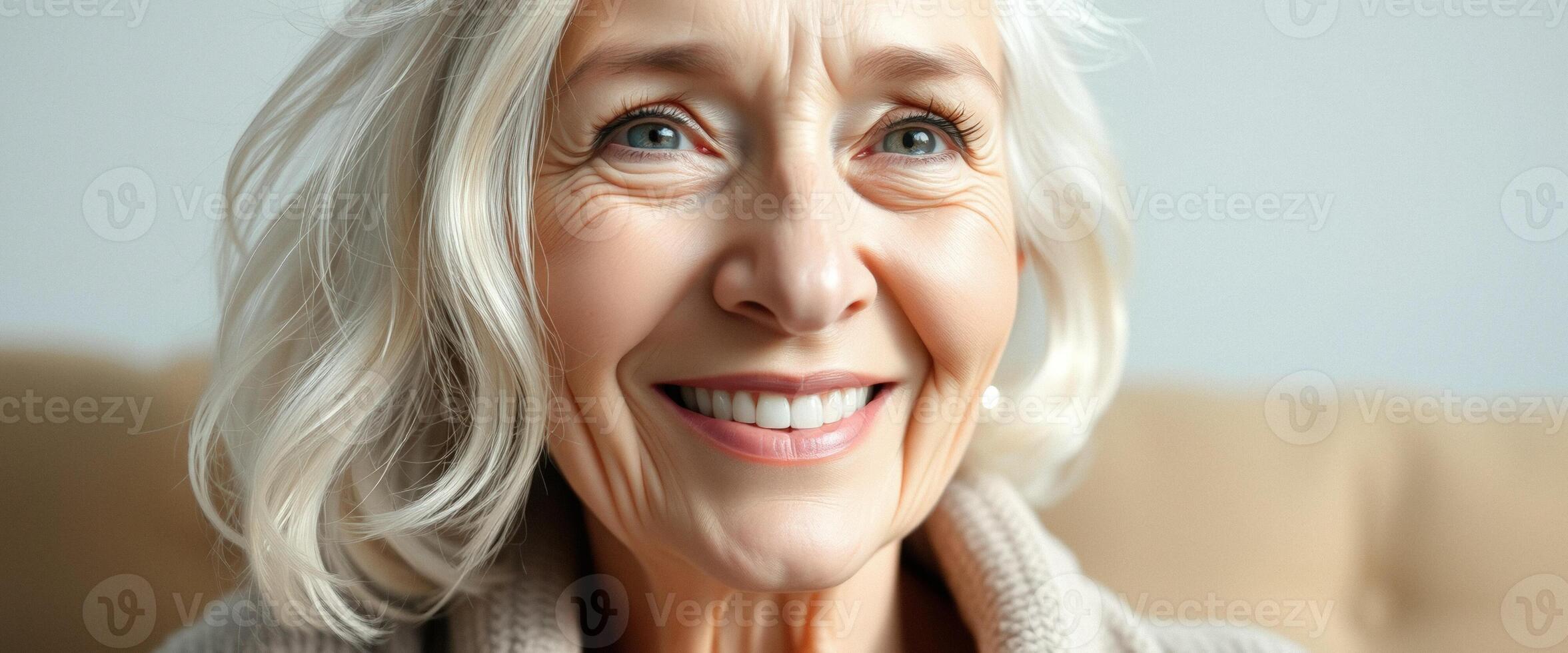 Close-up of a smiling senior woman with white hair photo