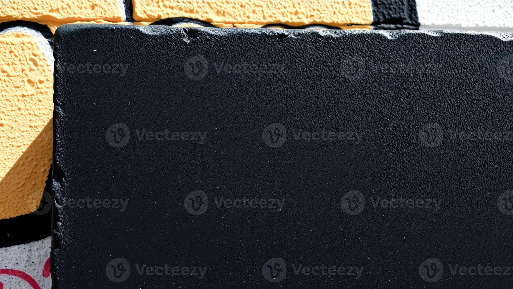 Black Textured Surface with Yellow and White Background photo