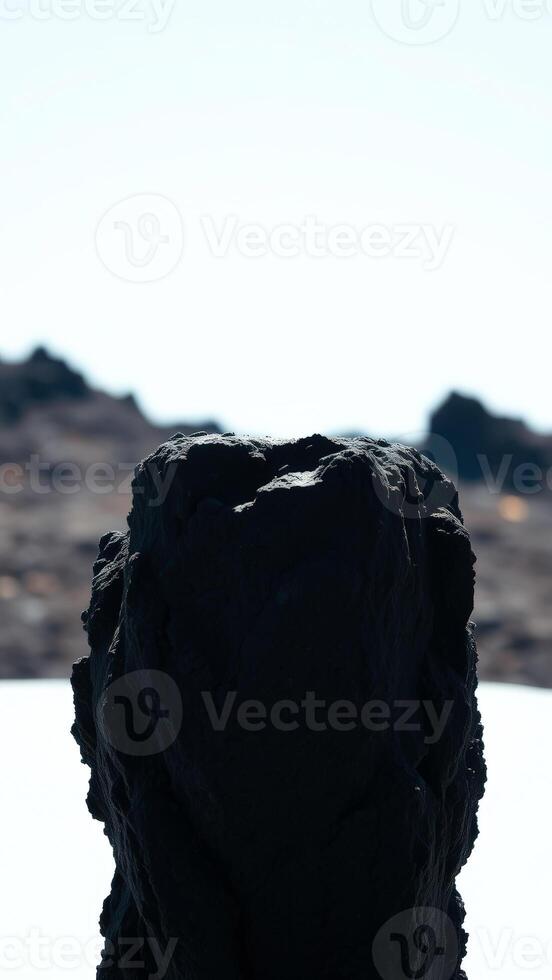 Black Rock Formation Against a Bright Sky photo