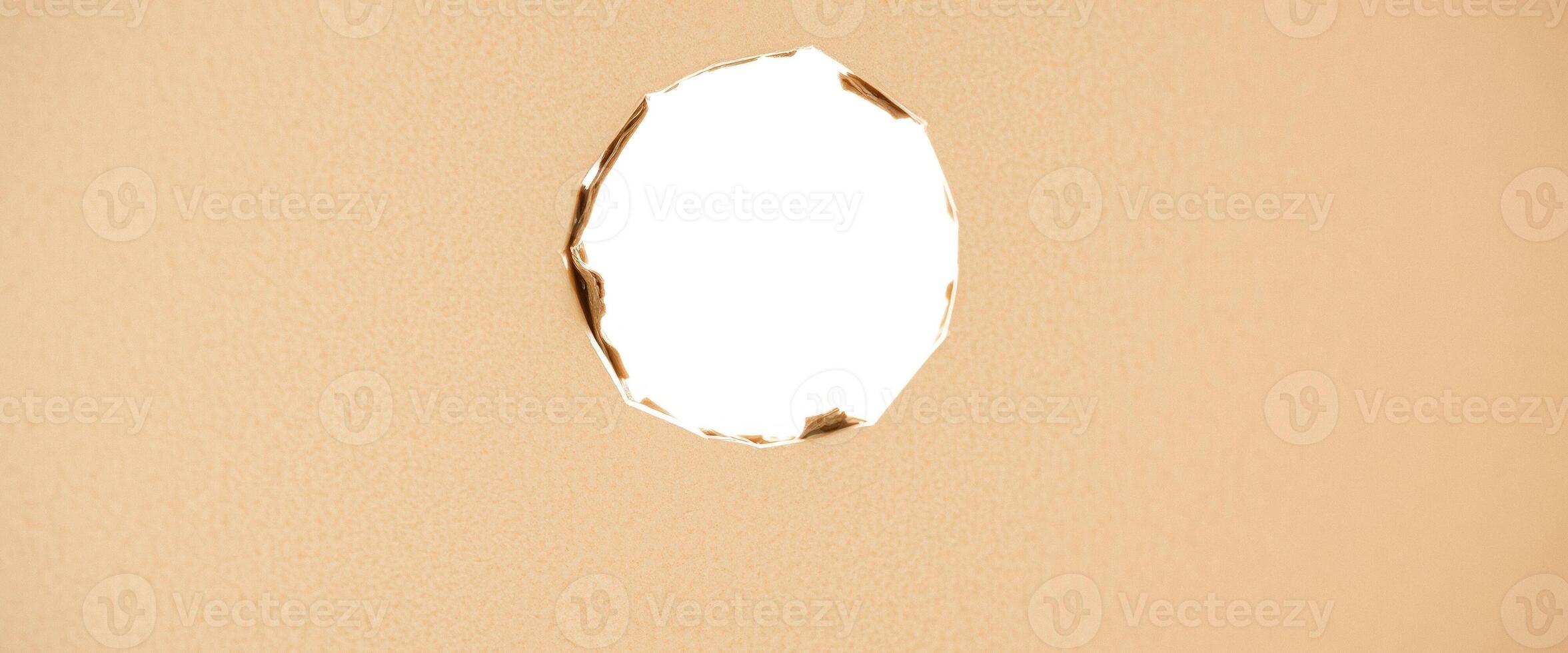 Hole in Beige Paper photo