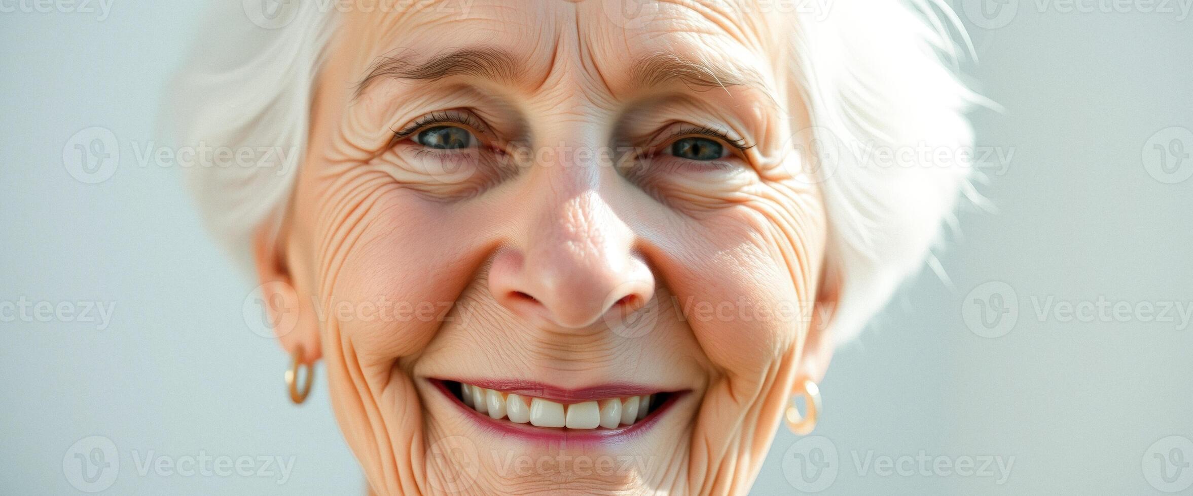 Close-up portrait of a smiling senior woman photo