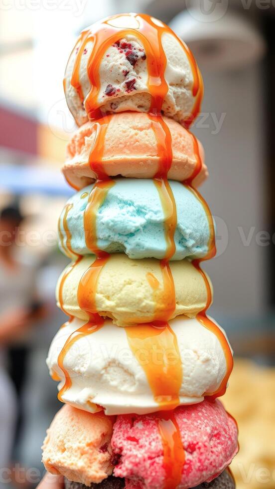 Close Up of Rainbow Ice Cream with Caramel Sauce photo