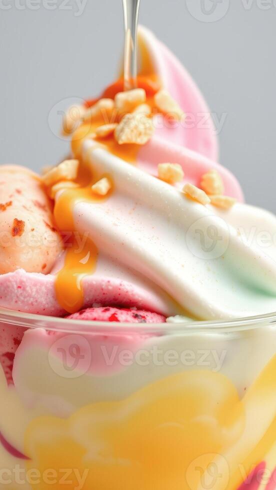 Close-up of Colorful Ice Cream Sundae with Caramel Sauce photo