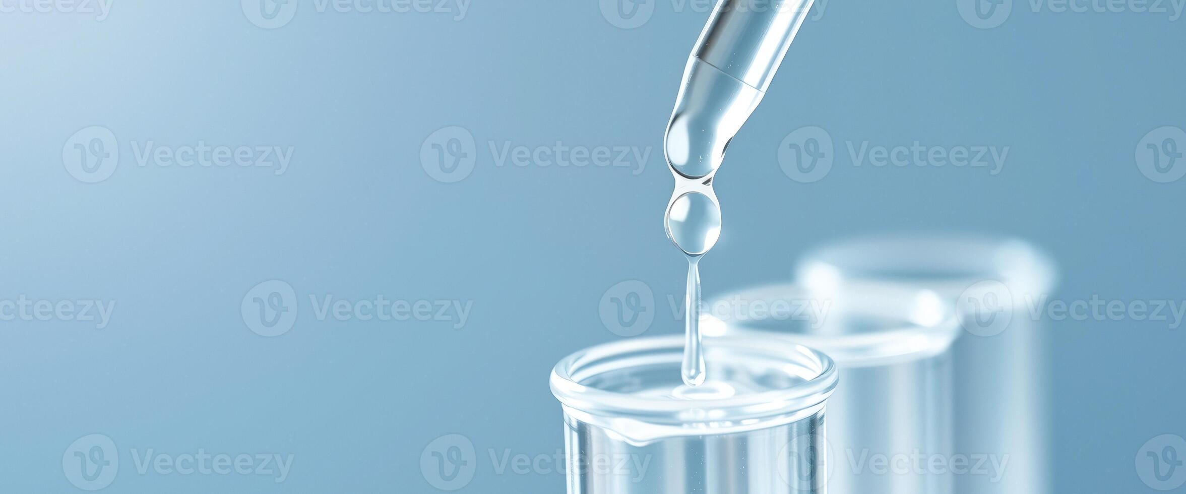 Droplet of liquid falling into a test tube photo