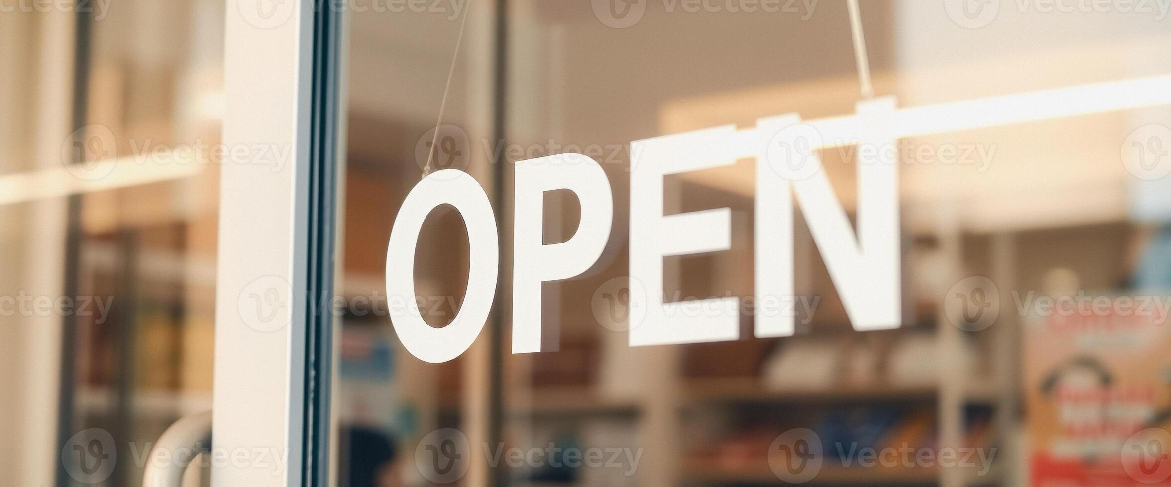 Open Sign Hanging on Glass Door photo