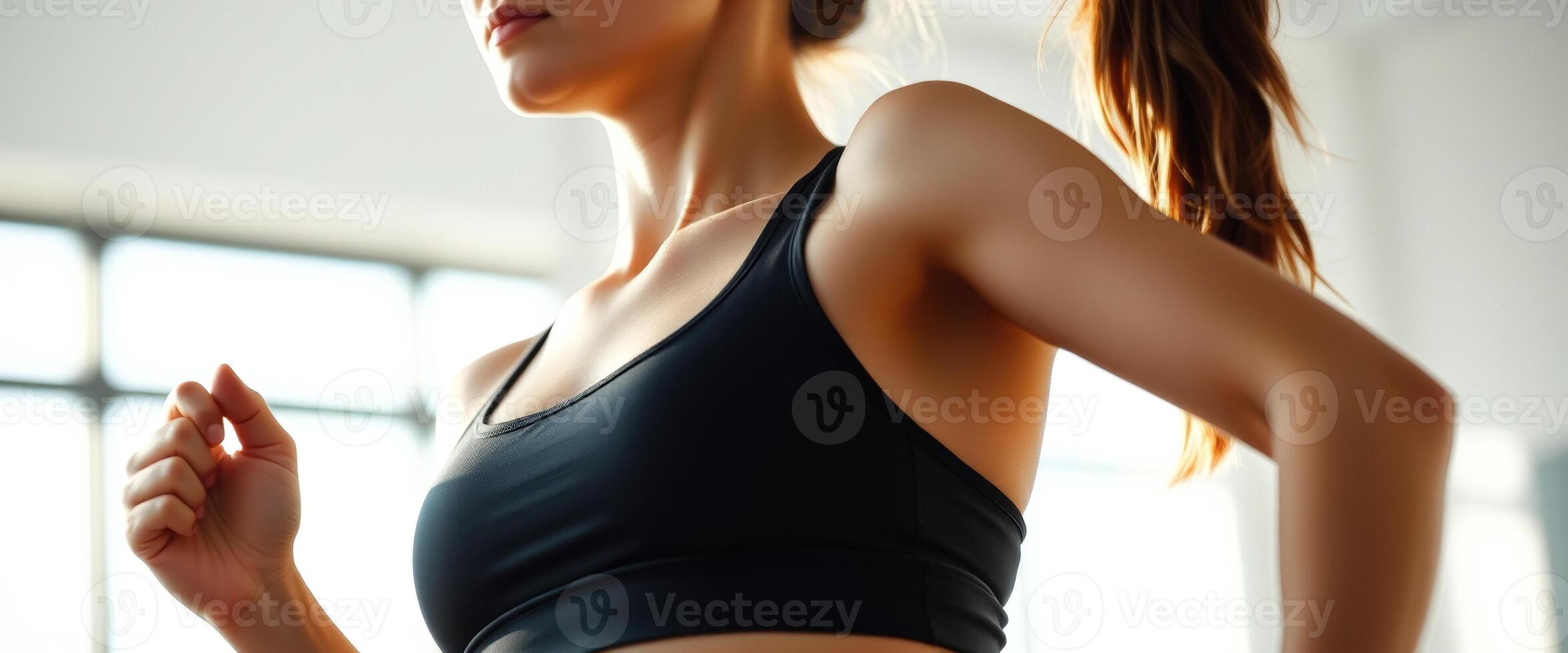 Close Up of a Woman's Arm and Shoulder While Exercising photo