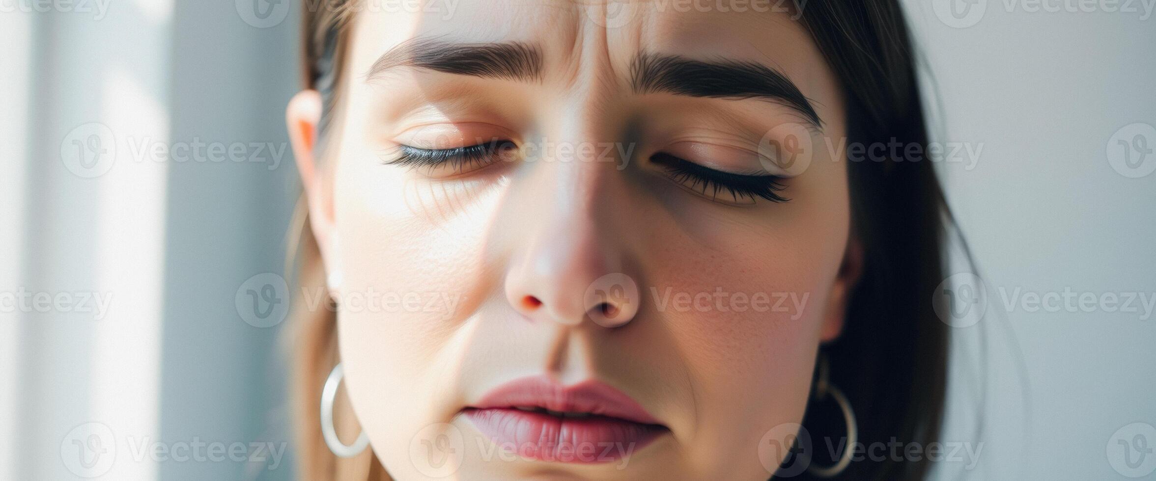 Close-up of a woman's face with eyes closed, showing wrinkles and natural beauty photo