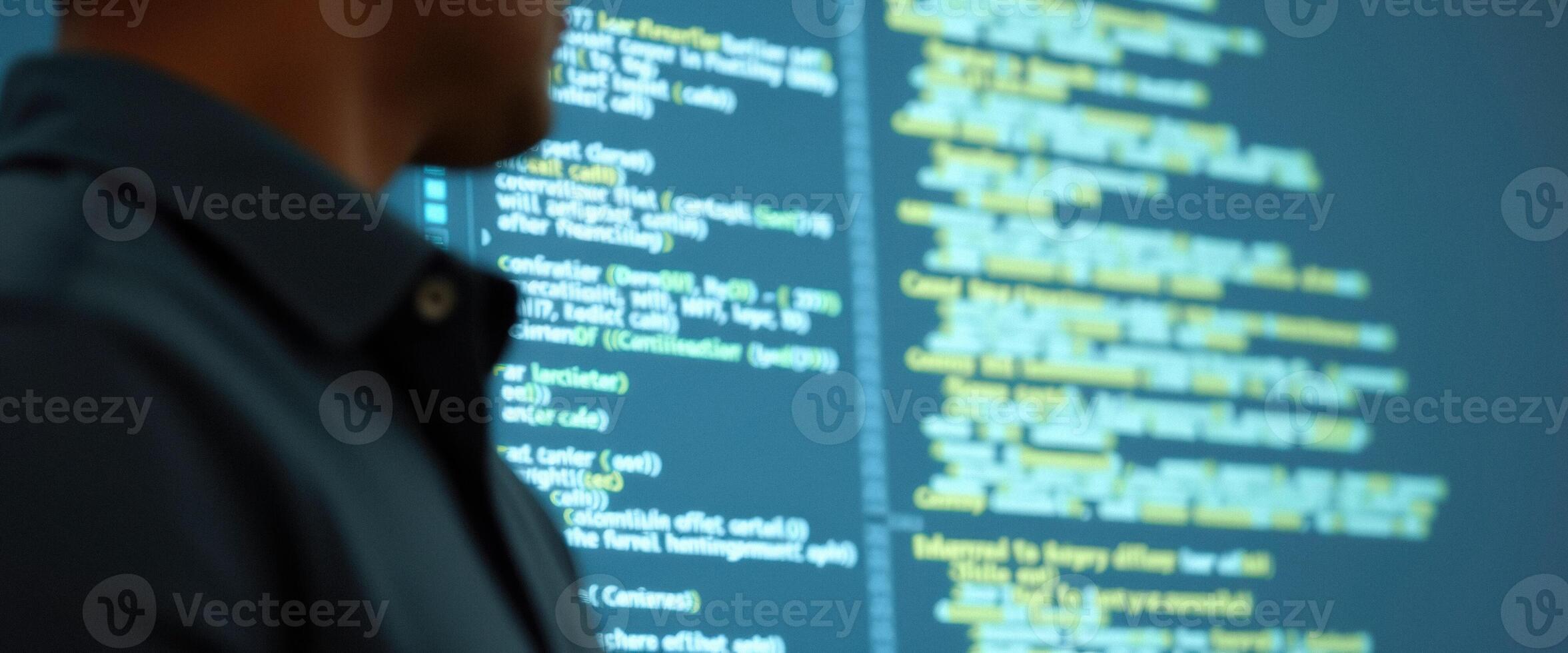 Blurred Developer Working on Code photo