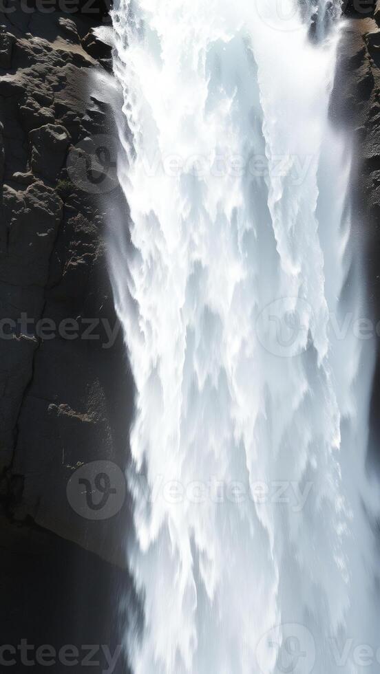 Closeup of a Waterfall Rushing Down a Cliff photo