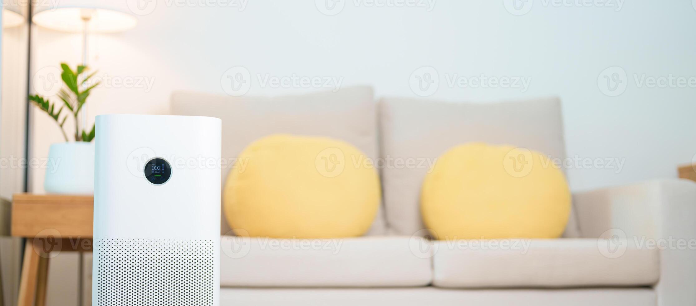 Air Purifier in cozy living room. Purification system for filter and cleaning or removing dust PM2.5 HEPA and virus in home. Allergy, Pure air, health lifestyle, Wellness life and Air Pollution photo