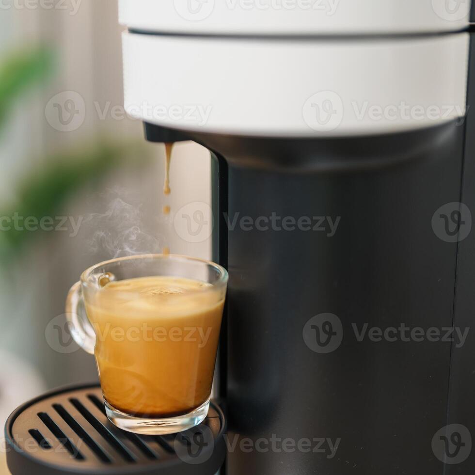Espresso cup with steam and froth during Coffee making Coffee by Coffee Maker Machine on wood table bar. Cafe shop, Daily beverage drink at Home, Apartment and Office concept photo