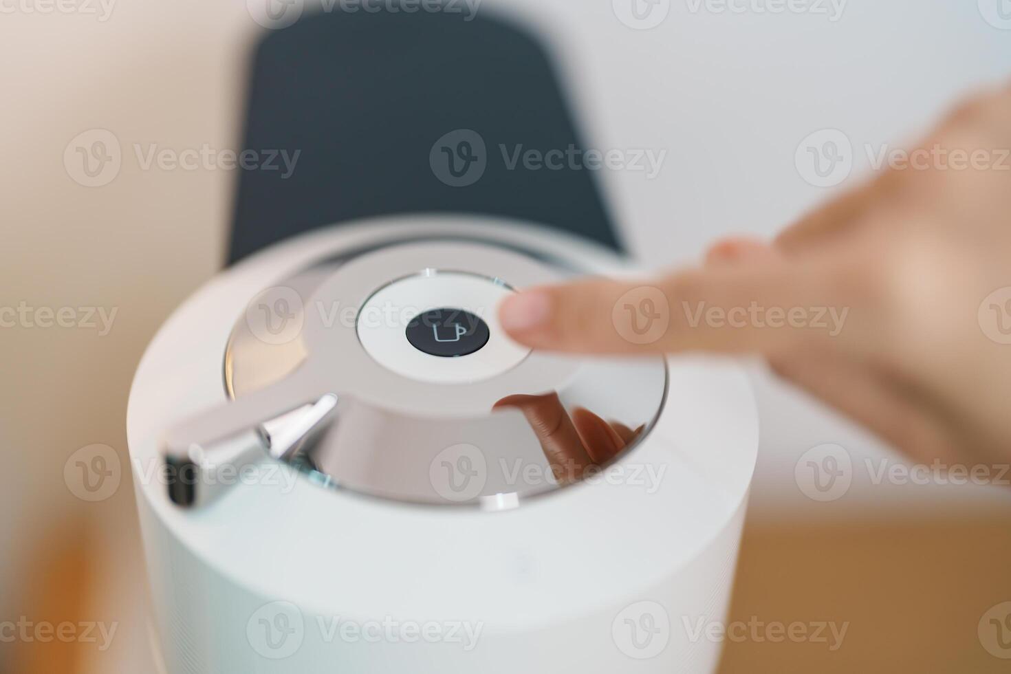 hand making Espresso Coffee by Coffee Maker Machine on wood table bar. Daily beverage drink at Home, Apartment and Office concept photo